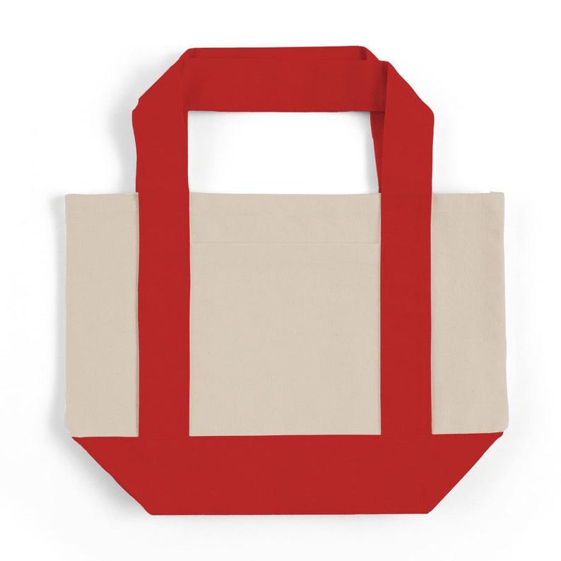 May include: A canvas tote bag with a cream-colored body and vibrant red accents. The bag features red handles and a red base, creating a striking contrast. This reusable tote is perfect for carrying groceries or everyday essentials.
