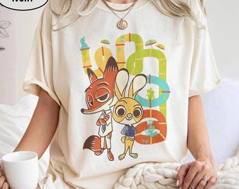 Disney Zootopia 2 Nick & Judy Shirts, Nick Wilde Whimsical Pipes Adventure Tee, Walt Disney Animation Studios Tee, WDW Magic Kingdom Holiday