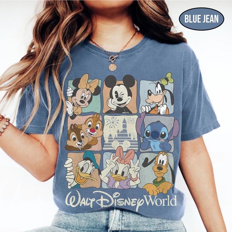May include: A blue jean colored t-shirt featuring a grid of nine squares displaying various Disney characters including Mickey Mouse, Minnie Mouse, Goofy, Donald Duck, Daisy Duck, Pluto, Chip, Dale, and Stitch, with the text Walt Disney World.