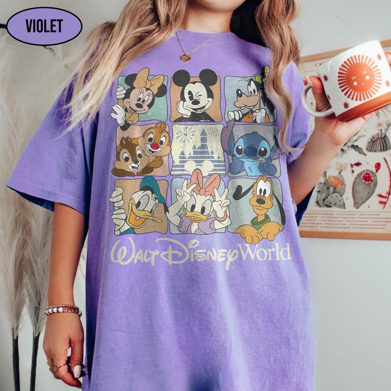 May include: A violet short-sleeve t-shirt featuring a grid of nine squares with various Disney characters including Mickey Mouse, Minnie Mouse, Donald Duck, Daisy Duck, Goofy, Pluto, Chip, Dale, and Stitch, with the text Walt Disney World below.