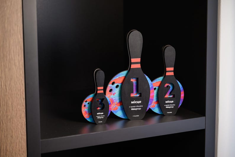 This Personalized Wooden Bowling Trophy with acrylic details is a stunning custom award, perfect for recognizing excellence in bowling leagues and corporate sports events.