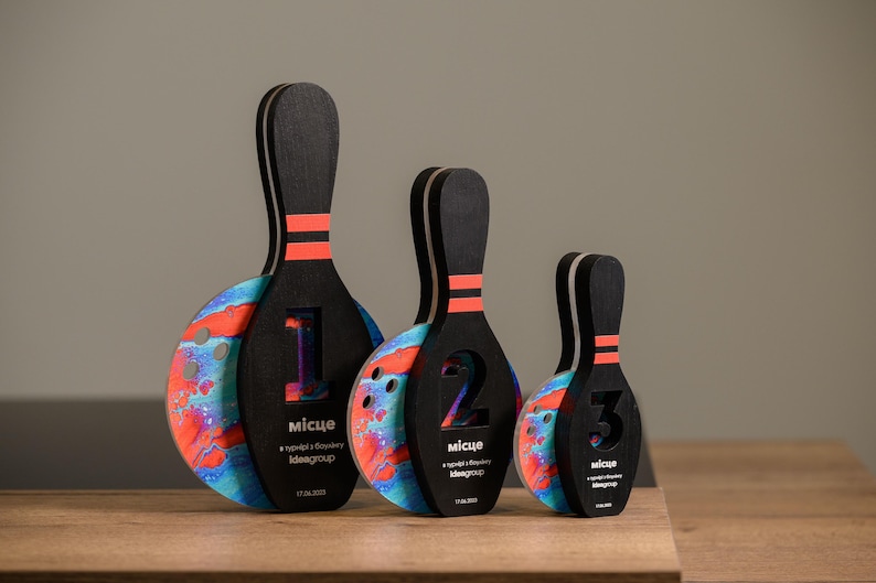 Celebrate bowling achievements with this Personalized Wooden Bowling Trophy featuring acrylic details. A perfect corporate sports gift and custom award for bowling events, tournaments, and league champions.