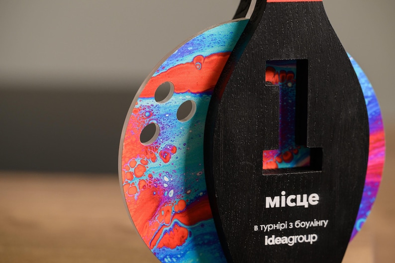 Honor bowling excellence with this Personalized Wooden Bowling Trophy, a sleek custom award with acrylic details. A perfect corporate sports gift for leagues, competitions, and team recognition.