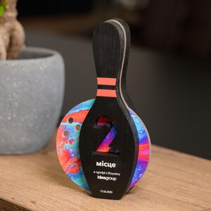 Recognize top bowlers with this Personalized Wooden Bowling Trophy, a high-quality custom award with acrylic details. A stylish corporate sports gift for professional and amateur bowling events.