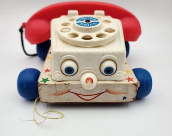 Teléfono de juguete para tirar Chatter de Fisher Price, modelo antiguo de 1961