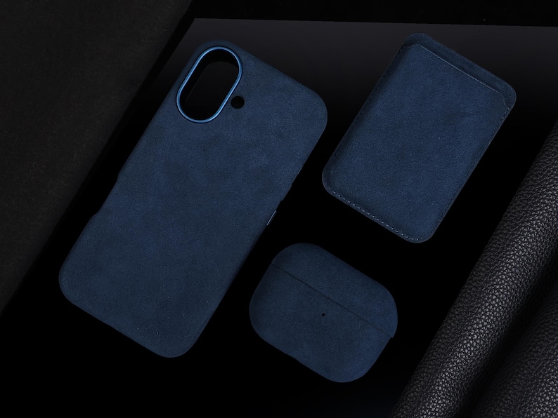 May include: Three blue suede cases, one for a phone, one for a wallet, and one for a pair of earbuds.