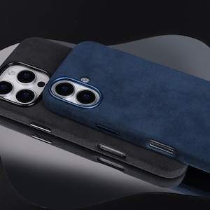 May include: Two phone cases, one gray and one blue, made of a soft, textured material. Both cases have a raised camera bump.