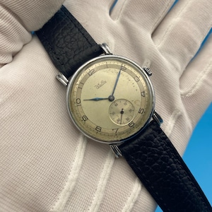 1940's Vintage Welta-herenhorloge: minder dan een seconde crèmekleurige wijzerplaat, handmatig opwindbaar