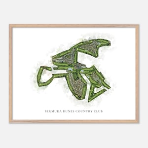 May include: A framed print featuring a watercolor-style map of Bermuda Dunes Country Club. The map shows the golf course layout in shades of green and brown, with the club's name printed in black at the bottom.