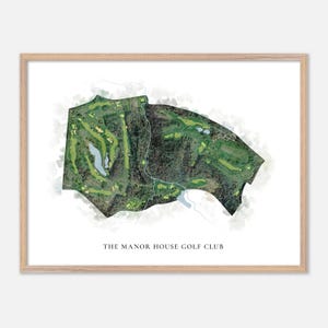 May include: A framed print depicting a golf course layout. The map shows green fairways, water features, and woodland areas, with the text "THE MANOR HOUSE GOLF CLUB" at the bottom. The frame is light-colored wood.