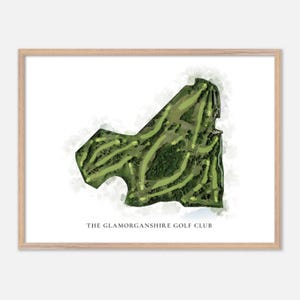 May include: A framed print featuring a watercolor-style map of a golf course. The course is rendered in shades of green, with fairways and greens visible. The text "THE GLAMORGANSHIRE GOLF CLUB" is printed at the bottom of the image.