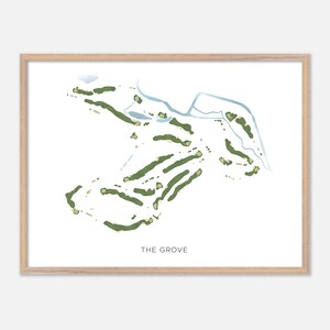 May include: A framed print of a golf course map, featuring green fairways and water features on a white background. The text "THE GROVE" is printed in a simple font at the bottom. The frame is made of light-colored wood.