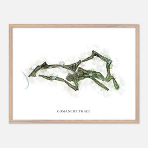 May include: A framed print featuring a watercolor map of Comanche Trace. The map is primarily green and brown, with a light green and white background. The text "COMANCHE TRACE" is printed in a simple font at the bottom of the image.
