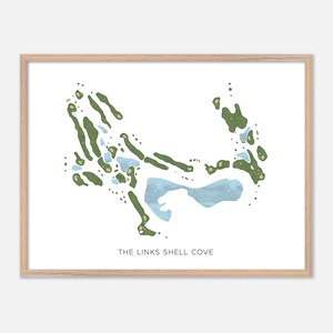 May include: A framed print showing a golf course layout with green areas and blue water features. The text "THE LINKS SHELL COVE" is at the bottom. The artwork is on a white background and framed in light wood.