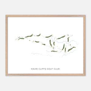 May include: A framed print featuring a minimalist golf course map. The course layout is depicted in shades of green and white, with the text "KAURI CLIFFS GOLF CLUB" at the bottom. The frame is a light wood color.
