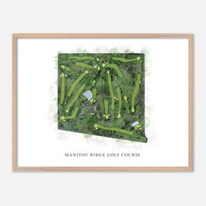 May include: A framed print of a golf course map in a watercolour style. The map depicts green fairways, water features, and trees. The text "MANITOU RIDGE GOLF COURSE" is printed at the bottom. The frame is made of light-coloured wood.