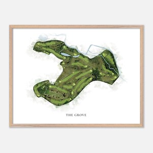 May include: A framed print of a golf course map, featuring a detailed aerial view of the green fairways, water features, and surrounding landscape. The print is labeled "THE GROVE" in a simple font, set against a white background.