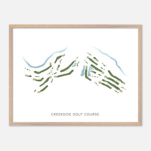 May include: A framed print featuring a watercolor map of a golf course. The course layout is depicted in shades of green, with blue water features and a light beige frame. The text "CREEKSIDE GOLF COURSE" is printed at the bottom.