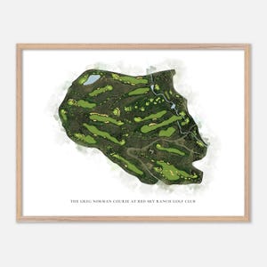 May include: A framed print of a golf course map. The course is rendered in shades of green and brown, with water features and fairways visible. The text at the bottom reads "THE GREG NORMAN COURSE AT RED SKY RANCH GOLF CLUB."