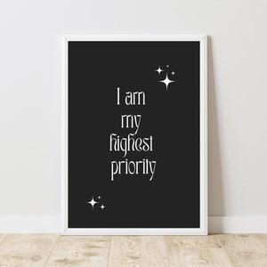 May include: Black and white printable wall art with the text "I am my highest priority" and small white stars on a black background.