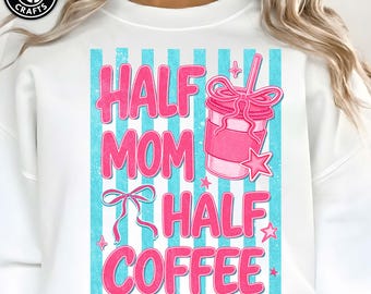 May include: White sweatshirt with the text "HALF MOM HALF COFFEE" in pink, set against a backdrop of blue vertical stripes. A pink coffee cup graphic with a bow and star accents is also featured.