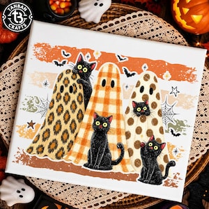 May include: A rectangular canvas print featuring three black cats wearing ghost costumes with leopard, plaid, and polka dot patterns. The background includes orange horizontal stripes, spider webs, stars, and bats. The Tanban Crafts logo is in the corner.