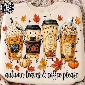 May include: A cream-colored sweatshirt featuring a graphic of four anthropomorphic coffee cups decorated with autumn motifs, pumpkins, and black cats. The text reads Witches Fuel, Fall Vibes & Warm Sips, Spooky Sips Happy Trips, and autumn leaves & coffee please.