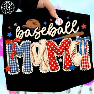 May include: Black baseball-themed design featuring the words "baseball MAMA" in a playful font. The design includes a baseball helmet, baseball bat, and baseballs, with the letters of "MAMA" decorated with baseball stitching and patterns in red, white, and blue.
