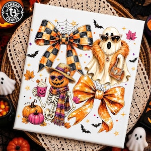 May include: A white canvas print featuring a Halloween-themed illustration with two large bows in orange and black plaid and solid orange, a ghost wearing sunglasses and a fur collar, and a skeleton wearing a hat and scarf holding a pumpkin mug.