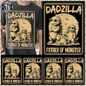 以下が含まれることがあります： サングラスをかけた漫画の恐竜一家が描かれた「DADZILLA」グラフィックのダークグレーTシャツ。「FATHER OF MONSTER」の文字と名前がデザインに含まれています。追加のデザインが下に表示されています。