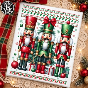 May include: A rectangular white sign featuring three nutcracker figures in red and green uniforms with gold accents. The design includes a festive border of holly leaves and berries, snowflakes, and gift boxes. The logo TANBAN CRAFTS is in the corner.