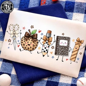 May include: A white rectangular fabric pouch featuring a colorful cartoon illustration of school supplies including scissors, a leopard print apple, a pencil, a composition notebook, and a ruler, each adorned with a brown bow and smiling faces.