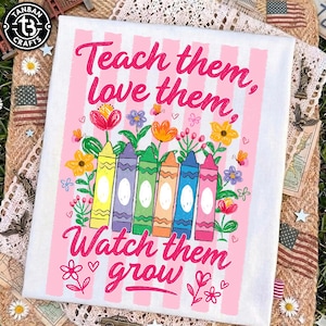 May include: White canvas with pink vertical stripes and the text "Teach them, love them, watch them grow" in pink. The design includes colorful flowers and six crayons in yellow, purple, green, orange, blue, and pink.