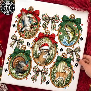 May include: A sheet of Christmas-themed decals featuring five oval frames with gold edges, each topped with a bow. The frames contain illustrations of a mallard duck, a bass, a turkey, and two deer, one wearing a Santa hat, surrounded by string lights.