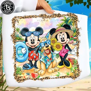 May include: White tote bag featuring Mickey Mouse, Minnie Mouse, and Pluto at the beach. Mickey wears sunglasses and swim trunks, Minnie holds sunflowers, and Pluto wears a Hawaiian shirt. The design is framed with a leopard print border.