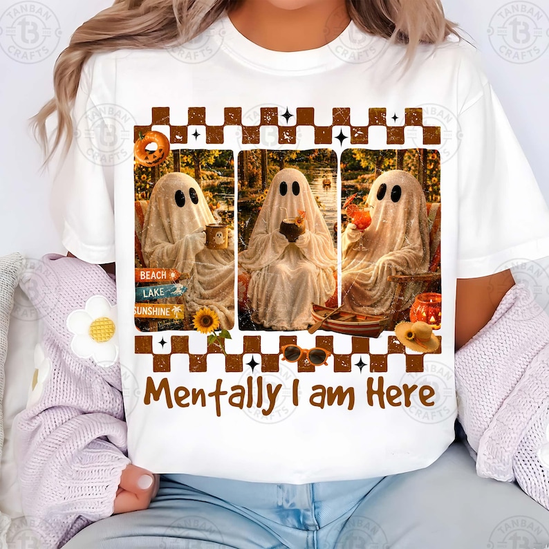 May include: White t-shirt featuring a graphic with three ghost figures in different settings, holding drinks. The text "Mentally I am Here" is below the images. The design includes a sign that says "Beach, Lake, Sunshine".