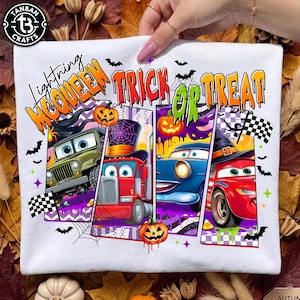 May include: A white t-shirt featuring a graphic print with the text Lightning McQueen TRICK OR TREAT. The design includes four vertical panels showing cartoon vehicles, including a green jeep, a red truck, a blue car, and a red race car, decorated with pumpkins, bats, spiderwebs, and checkered flags.