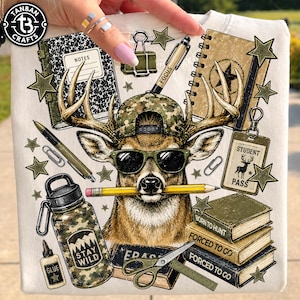 May include: A cream-coloured t-shirt featuring a graphic of a deer wearing a camouflage baseball cap and sunglasses with a pencil in its mouth. Surrounding the deer are school supplies, books labelled Born to Hunt and Forced to Go, and a student pass.