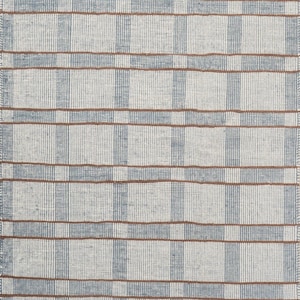May include: A rectangular rug with a woven texture. The rug features a grid pattern of light blue vertical stripes and brown horizontal stripes against a white background. The rug's design is simple and geometric.