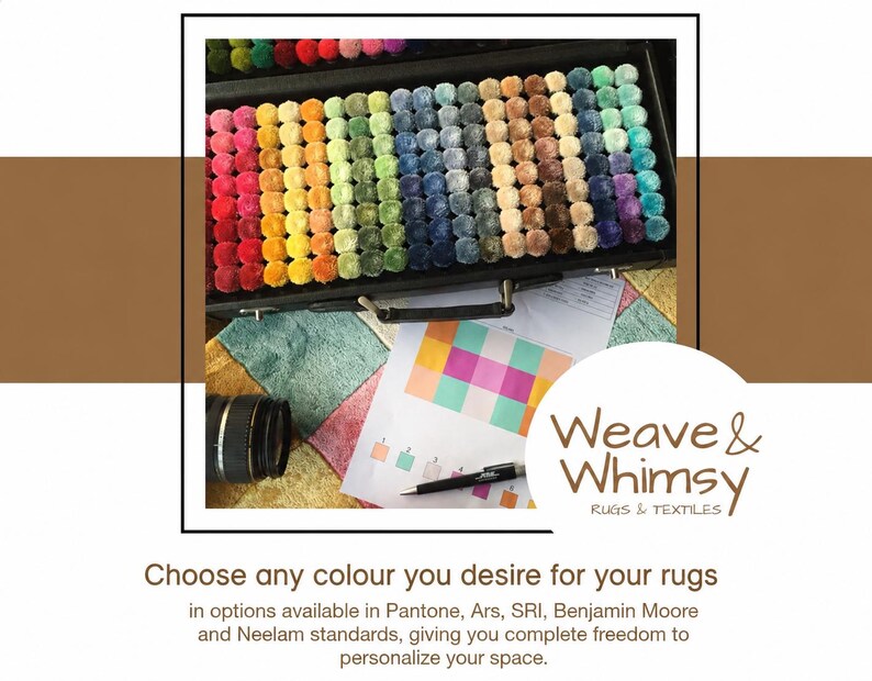 May include: A black carrying case filled with rows of small, round, multi-colored yarn pom-poms arranged in a spectrum. Below the case lies a color chart, a black pen, and a camera lens. The text reads Weave & Whimsy RUGS & TEXTILES.