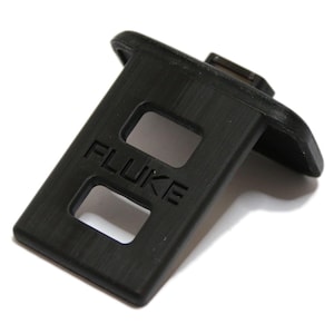 Könnte beinhalten: Schwarzer magnetischer Halter aus Kunststoff mit dem Aufdruck "FLUKE".
