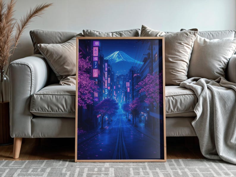 May include: A digital art print of a city street at night with pink cherry blossoms and a mountain in the distance. The street is lit with neon lights and the buildings are tall and modern.