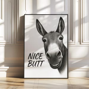 May include: Black and white illustration of a donkey's head with the text "NICE BUTT" printed below.