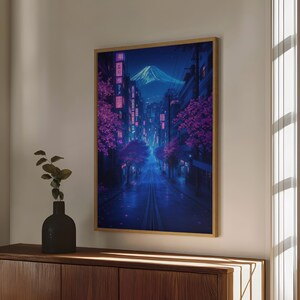 May include: A digital art print of a city street at night with a mountain in the background. The street is lined with trees with pink blossoms and buildings with neon lights. The sky is dark blue with a few stars.