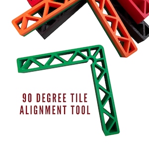 May include: A green 90-degree tile alignment tool with a triangular design. The text "90 DEGREE TILE ALIGNMENT TOOL" is displayed in maroon. Other tools in orange, red, and black are also visible.