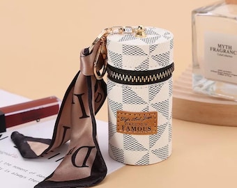 Luxury Cylinder Lipstick Carrier, coins bag , Keychain Pendant and Handbag charm.