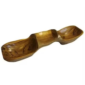 May include: A wooden serving bowl with three connected sections. The bowl is made of light brown wood with visible grain patterns. The design is organic and flowing, suitable for serving snacks or appetizers.