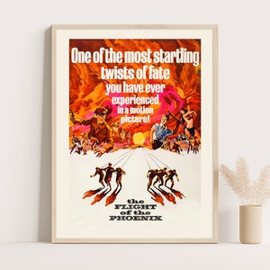 May include: A vintage movie poster for the film "The Flight of the Phoenix" featuring a dramatic scene of men escaping a plane crash in the desert. The poster has a red, orange, and yellow color scheme with the title in white text.