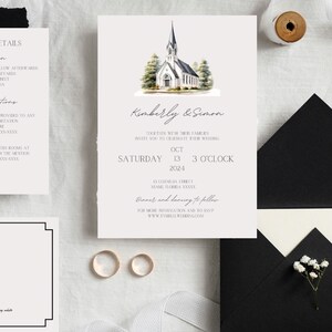 May include: Wedding invitation suite with a watercolor illustration of a white church with a steeple. The invitation includes the names Kimberly & Simon, the date Saturday, October 13, 2024, and the time 3 o'clock. The RSVP card includes a QR code.
