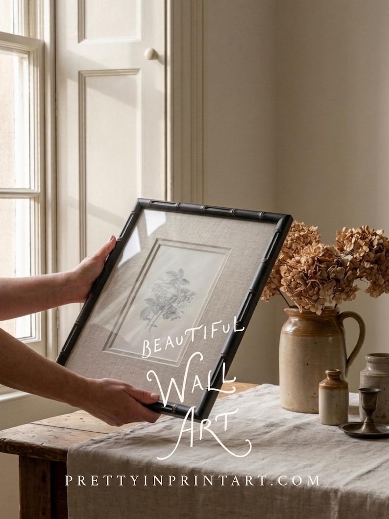 May include: A framed botanical print with a black bamboo-style frame. The print features a detailed floral illustration on a neutral linen background. The words "BEAUTIFUL WALL ART" are written on the image.